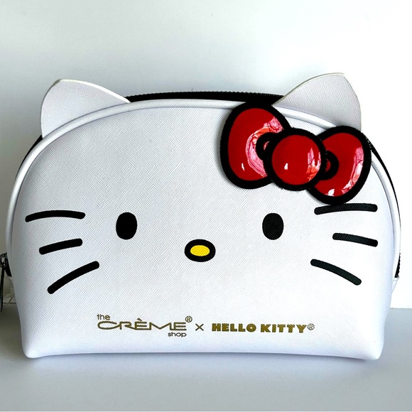 Hello Kitty Handbags - 🩷NWT Hello Kitty Cosmetic/Makeup Bag. White with Red 3D Bow